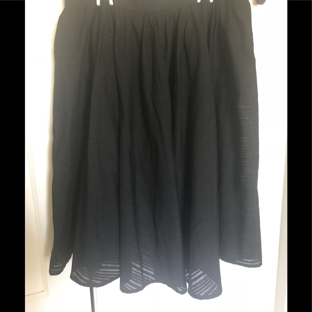 Black flow skirt with under skirt.